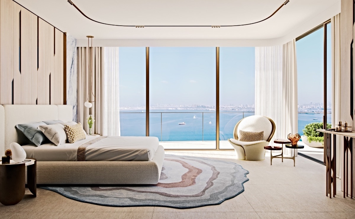 Master bedroom of a high floor apartment in The Mural overlooking the sea and Dubai skyline